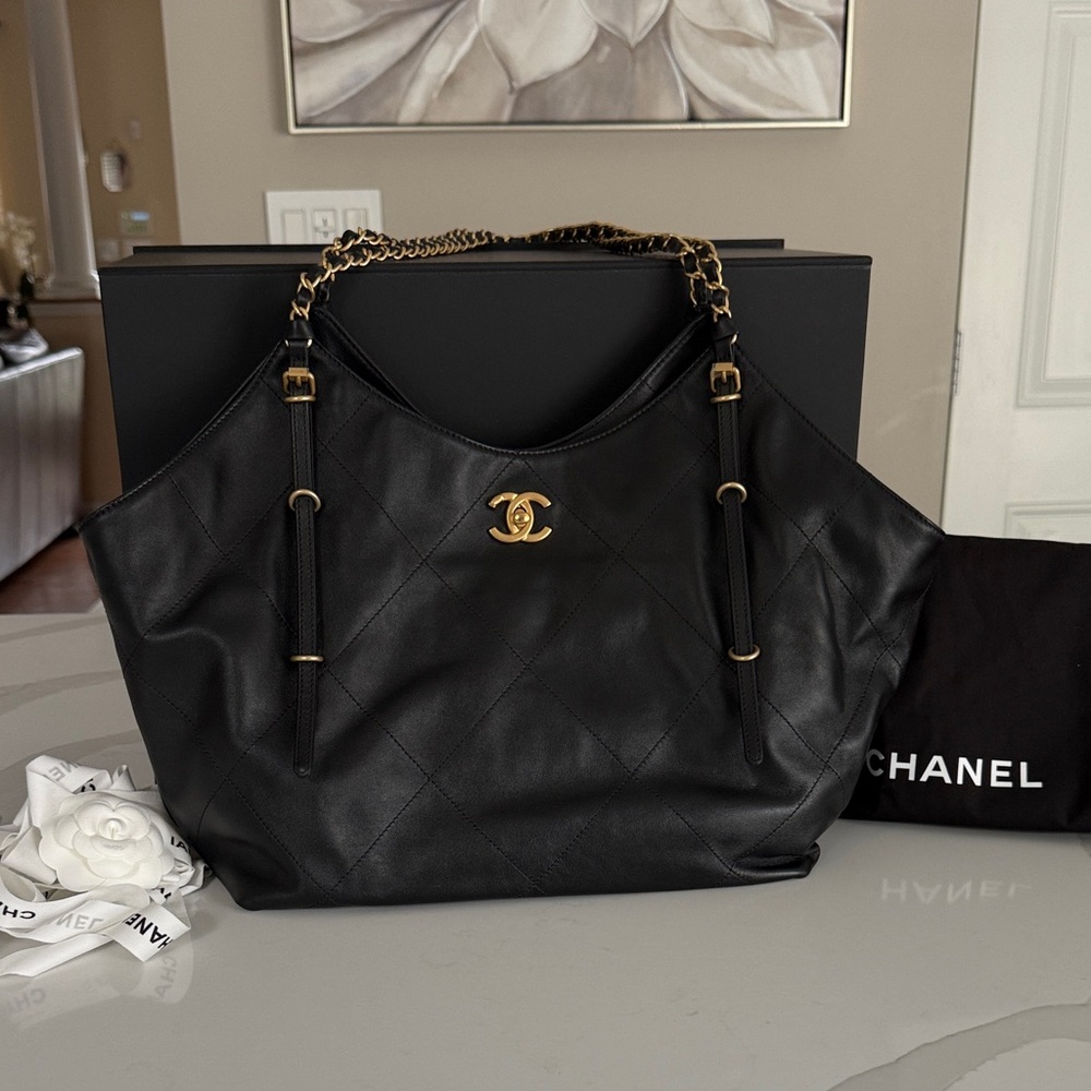 CHANEL- Black Quilted Leather Shoulder Bag with Gold Accents